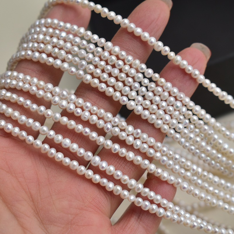 Beading - Natural freshwater pearls, white, 3-7mm egg-shaped
